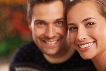 Image showing Portrait, Christmas and couple with love, festive season and party with romance and home with Xmas. Face, apartment and man with woman or celebration with holiday and smile with marriage and cheerful