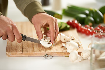 Image showing Vegetables, cooking and hands cutting mushroom on kitchen counter with salad, wellness and nutrition in home. Wood board, knife and healthy food with brunch, chef and vegan meal prep in apartment