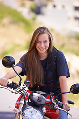 Image showing Happy woman, portrait and motorcycle in city for ride, road trip or outdoor travel in nature. Extreme female person, biker or rider with smile on motorbike or vehicle for transport or sightseeing