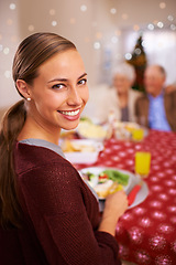 Image showing Portrait, Christmas and woman with her family, lunch and relaxing with festive season and healthy meal. Face, smile or people with social gathering or home with fun or Xmas with holiday food or break