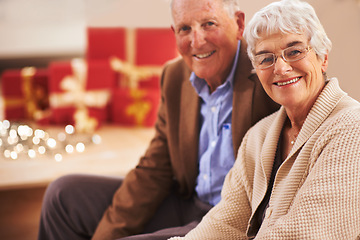 Image showing Elderly couple, portrait and Christmas with gifts or festive season in Canada or vacation, bonding or celebration. Man, woman and face with fairy lights or happy with box package, holiday or together