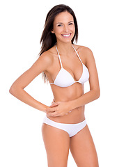 Image showing Woman, portrait and bikini for fashion and beauty with smile, swimwear style with cosmetics and skin on white background. Healthy glow, wellness with model in beach wear or underwear in studio