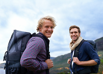 Image showing Happy man, portrait and friends with backpack for hiking mountain, travel or sightseeing on outdoor journey in nature. Male person or young hikers with bag on back for trekking, fitness or adventure