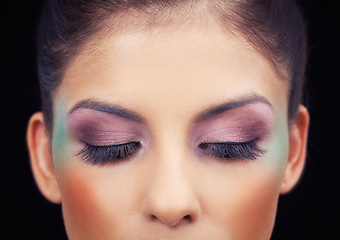 Image showing Colorful, makeup and creative eyeshadow with woman in studio and black background with beauty. Cosmetics, creativity and model with unique rainbow aesthetic on face to glow or shine with confidence