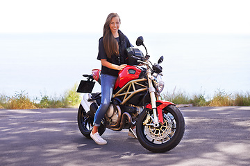 Image showing Happy woman, rider and motorcycle by the ocean for road trip, travel or outdoor holiday in nature. Female person or biker with smile on hot ride or bike with helmet for transport on mockup space