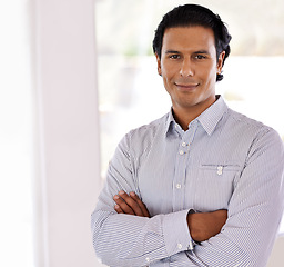 Image showing Confidence, smile and portrait of Indian businessman, entrepreneur or manager in office. Director, small business owner and face of happy man with arms crossed in professional workplace with pride.