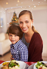 Image showing Mother, child and portrait with Christmas dinner for celebration, smile and bond over festive season. Parent, kid and together with meal for celebration, xmas and holiday with food for family