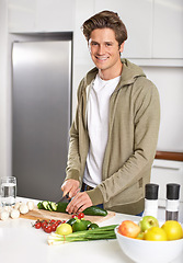 Image showing Diet, cooking and man cutting vegetables on kitchen counter with salad, wellness and nutrition in home. Wood board, knife and healthy food process with brunch, chef and vegan meal prep in apartment