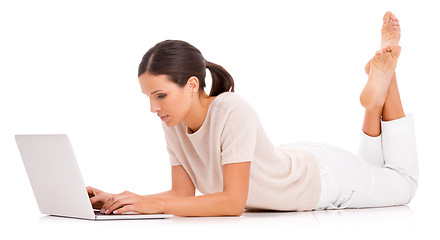 Image showing Woman, laptop and typing in studio for online communication as journalist for research project, networking or internet. Female person, white background and mockup or teach writing, email or browsing