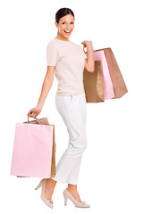 Image showing Excited, shopping and portrait of woman on a white background with bag for sale, discount and deal. Fashion, happy customer and isolated person for retail products, consumerism and purchase in studio