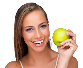 Image showing Portrait, smile and apple for wellness with woman in studio isolated on white background for diet. Face, health and nutrition with happy young vegan model holding organic green fruit for detox