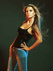 Image showing Woman, fashion and nightclub aesthetic with beauty, sequence and shine for style isolated on green background. Feminine clothes, jeans and sparkle top with cosmetics portrait for night life and glow