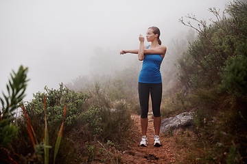 Image showing Fitness, woman and stretching arms in nature, wellness or sports with fog. Park, serious runner and warm up outdoor with mist for exercise, training and thinking of workout for body health on mockup