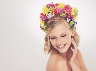 Image showing Woman, face and flowers on crown in studio with makeup and happiness for cosmetics, beauty and skincare. Spring aesthetic, model and floral headband with mockup space and wellness on white background