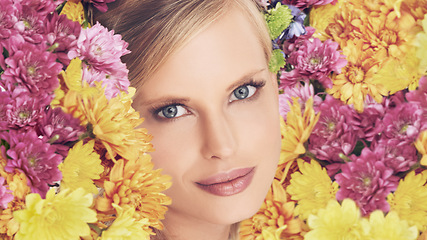 Image showing Woman, portrait and flowers with makeup for beauty, creativity and wellness with spring aesthetic and floral art. Model, organic cosmetics and carnation plants for facial glow, smile and flowerbed