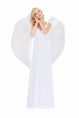 Image showing Holy, angel wings and woman with peace, calm and person isolated on white studio background. Girl, guardian and religion with worship or spiritual with faith and trust with hope, goddess or celestial