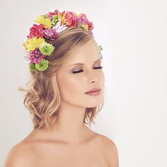 Image showing Woman, makeup and flowers on crown in studio with face and confidence for cosmetics, beauty and skincare. Spring aesthetic, model and floral headband with mockup space or wellness on white background
