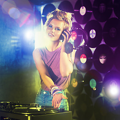 Image showing Nightclub, DJ and portrait of woman playing music with headphones and vinyl record on table. Techno, rave and musician at concert, event mixing sound and audio for entertainment at party at night