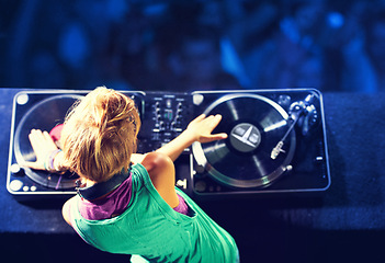 Image showing Person, hands and turntable for nightclub performance for celebration dance party for listen, entertainment or event. Dj, headphones and techno in Florida for new year crowd, audience or electronic