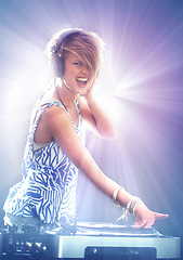 Image showing Woman, dj and portrait with headphones for music on stage with lens flare, mixing and gig at rave party for entertainment. Female sound mixer, artist and musician with record player for playlist