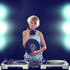 Image showing Portrait, concert and woman dj with mixer on dark background for entertainment at club, disco or party. Music, dance or performance with light for performance and disc jockey mixing audio or sound