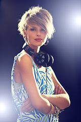 Image showing Portrait, smile and headphones with woman, arms crossed and dj with mixes, online sound and audio track. Face, person or girl with headset or lights with hip hop and podcast on dark studio background