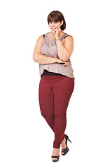 Image showing Portrait, trendy and outfit with plus size woman in studio isolated on white background for style. Clothes, confidence or fashion model with attitude in clothing and high heels for casual wear