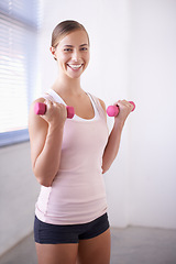 Image showing Woman, portrait and dumbbell for weight training in home with exercise, smile and workout. Happy, wellness and gym equipment for health and athlete with fitness for strength and confidence in house