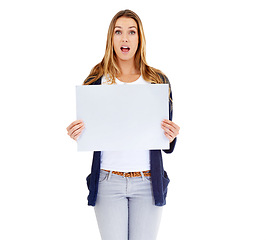 Image showing Studio, blank sign and portrait of woman in shock for deal, promo or happy news mockup. Signage, offer and excited girl with poster announcement, discount or info on cardboard with white background.