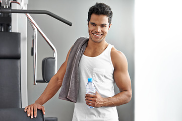 Image showing Fitness, portrait and happy man with water at gym for weightlifting, training or wellness, exercise or cardio. Face, smile and male bodybuilder with sports drink for workout, recovery or hydration