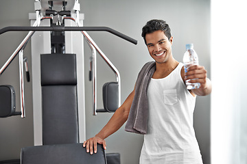 Image showing Happy, portrait and man at gym with water bottle for recovery after exercise for body building. Healthy, fitness and person relax after workout with hydration for benefits to wellness in Mexico