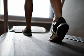 Image showing Sports, feet and person running on treadmill in gym for health, wellness and body training. Active, shoes and closeup of athlete with workout or exercise on cardio machine at fitness center.