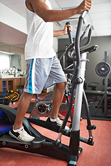Image showing Fitness, legs and air walker with man in gym for health, wellness or workout to improve cardio. Exercise, running and sports with athlete on glider machine for endurance . training as marathon runner