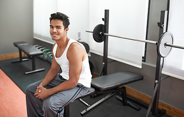 Image showing Weights, bench and portrait of man at gym with happiness for workout as body builder in Mexico. Healthy, person and smile after weightlifting exercise for strong muscle, fitness and training arms