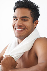 Image showing Smile, fitness and portrait of man with towel in studio for body workout or muscle training. Happy, sports and young male athlete with cloth for health or wellness exercise by white background.