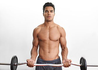 Image showing Man lifting barbell, portrait and fitness in gym, strength training and endurance with bodybuilding. Exercise, mockup space and person with equipment, power and workout in a wellness center or muscle