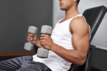 Image showing Closeup, dumbbells and man with fitness, exercise and strength training with progress and challenge. Bodybuilder, gym and person with gym equipment and muscle with workout, wellness center and power