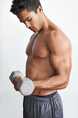 Image showing Man, workout and dumbbell exercise for arm endurance or gym routine for challenge, wellness or bodybuilder. Male person, equipment and white background in studio for training, shirtless or mockup