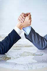 Image showing Map, arm wrestle and power struggle with business people in studio for battle, competition or war. Hands, strategy or challenge with corporate employee and rival fighting for global domination