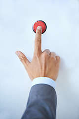 Image showing Businessman, hands and red button for war, nuclear launch or initiation on a blue studio background. Closeup of man or president touching switch for nuke, control or emergency in safety or security