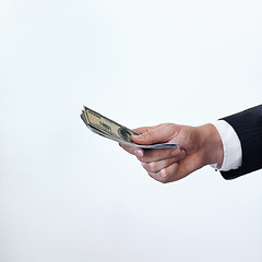 Image showing Business person, hands and money with payment or bribe for agreement or deal on a white studio background. Closeup of employee with cash, dollar bills or paper for secret, bribery or fraud on mockup