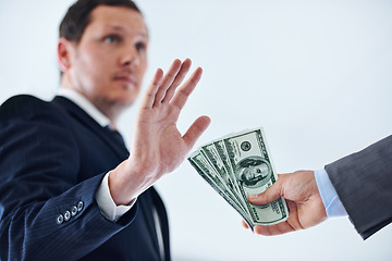 Image showing Businessman, hands and rejection with money for bribe, payment or fraud on a white studio background. Man or employee saying no to cash, dollar bills or paper for scam, secret or bribery on mockup