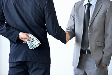 Image showing Handshake, deal with corruption and business people in meeting, illegal partnership and fraud with money laundering. Agreement, collaboration and payment for crime with bribery on white background