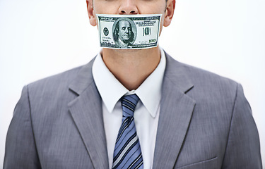 Image showing Business man, money and mouth for silence, bribe or corruption with suit in studio by white background. Person, cash and quiet for corporate crime with fraud, finance or illegal payment at job in USA