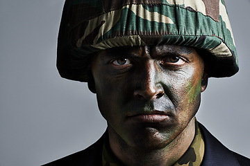 Image showing Man, portrait and soldier with camouflage for military war or battle on a gray studio background. Closeup of male person, army or commander with face paint or helmet in undercover disguise on mockup