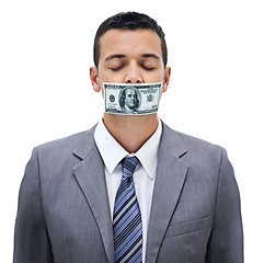 Image showing Business man, money and mouth for silence, bribe or corruption with suit in studio by white background. Person, cash and quiet for corporate crime with fraud, finance and payment with eyes closed