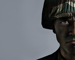 Image showing Man, portrait and soldier with camouflage for army, military war or battle on a gray studio background. Closeup of male person or commander with face paint or helmet in undercover disguise on mockup