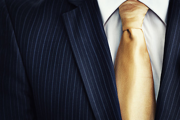 Image showing Businessman, suit and gold tie in fashion for corporate style, attire or clothing with jacket, lines or pattern. Closeup of man, worker or employee in stylish shirt of neat professional with necktie