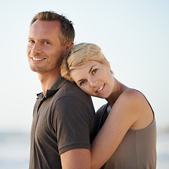 Image showing Couple, hug and portrait on beach or holiday relax in California for marriage vacation, together or summer. Man, woman and face for date in paradise for stress relief or outdoor, calm or relationship