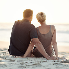 Image showing Couple, beach and sunset relax or travel vacation on tropical island for marriage commitment, holiday or paradise. Man, woman and rear view on sea sand in California for date together, rest or summer